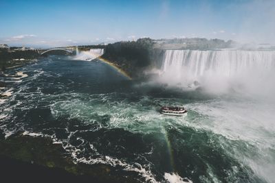 Majestic view of waterfall against sky
