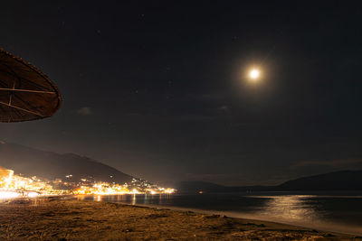 Scenic view of sea against sky at night