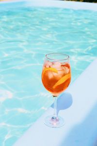 Close-up of drink in swimming pool