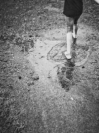 Low section of woman standing on tiled floor