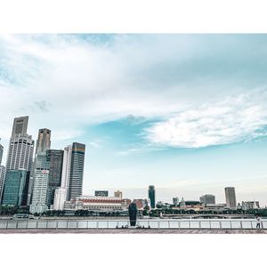Buildings in city against sky