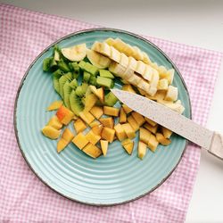 High angle view of chopped vegetables on cutting board