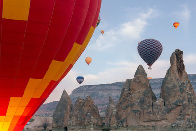 Low angle view of hot air balloons against sky