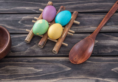 High angle view of easter eggs with spatula on table