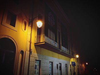 Low angle view of illuminated building at night