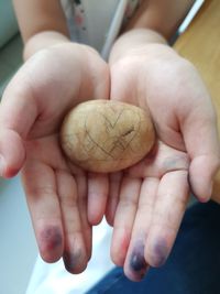 Close-up of hand holding baby