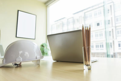 Close-up of electric lamp on table