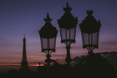 Low angle view of lit structure against sky