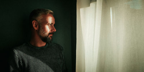 Portrait of young man looking away