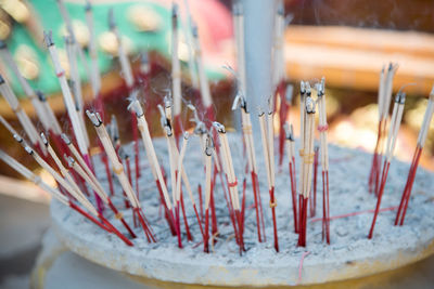 Close-up of incense at temple