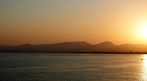 Scenic view of mountains against sky during sunset