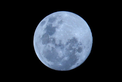 Low angle view of moon against sky at night