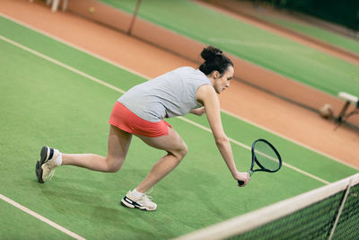 Tennis player playing at court