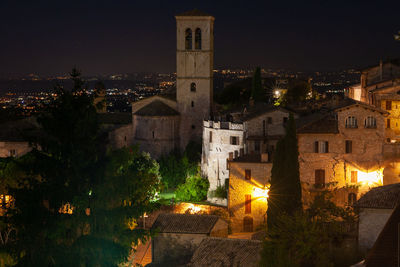 Illuminated buildings in city at night