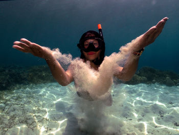 Man swimming in sea