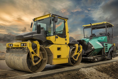 Construction machinery on road against sky