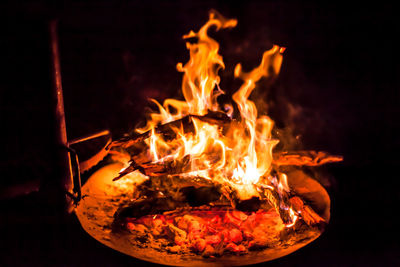 Close-up of fire in pit at night