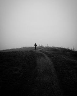 Man on agricultural field against sky