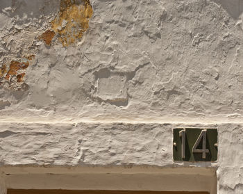 Low angle view of weathered wall of old building