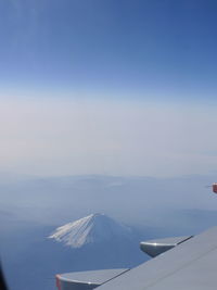 Scenic view of snow mountains against sky