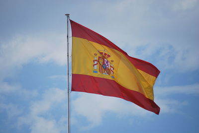 Low angle view of flag against sky