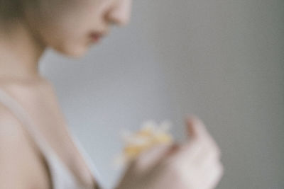 Close-up of hand holding flower