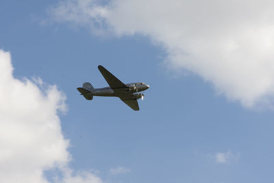 Low angle view of airplane flying in sky