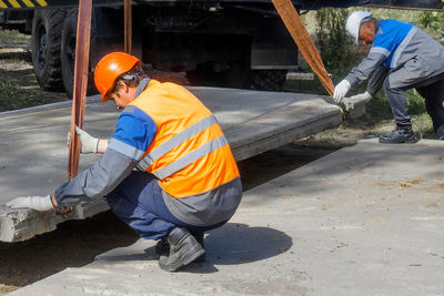 Rear view of man working at construction site