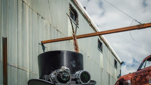 Close-up of motorcycle against sky
