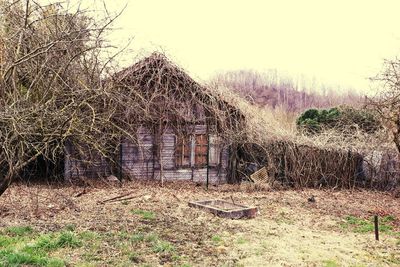 Abandoned built structure on field against sky