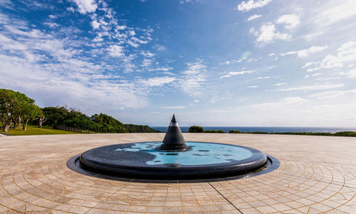 Fountain against blue sky