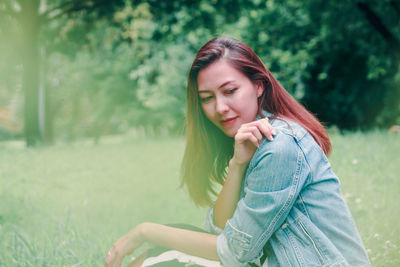 Portrait of woman sitting outdoors