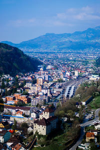 High angle view of houses in town against sky
