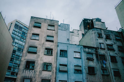 Low angle view of neglected apartment buildings in são paulo, brazil