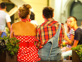 Rear view of couple standing outdoors