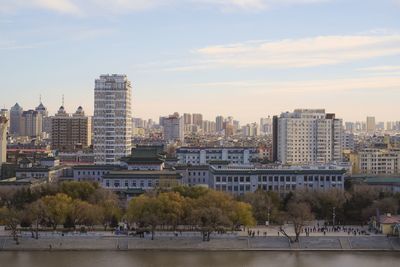 Buildings in city against sky