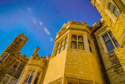 Low angle view of building against blue sky