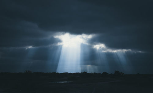 Low angle view of cloudy sky at night
