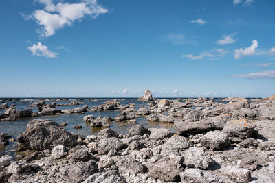 View of rocks on beach against sky