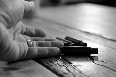 Cropped hand of person by cartridges