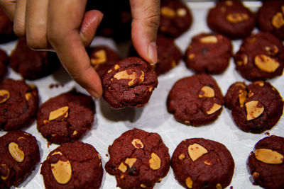 Midsection of person holding cookies