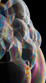 Close-up of bubbles over black background