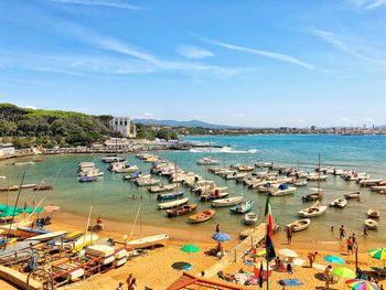 High angle view of boats moored on beach against sky