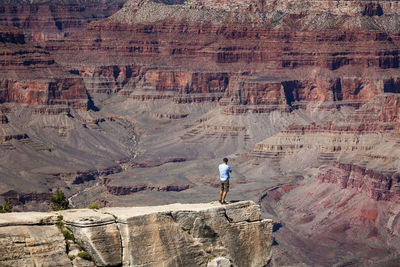 Full length of man standing on rock