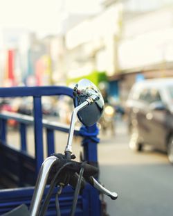 Close-up of bicycle on street