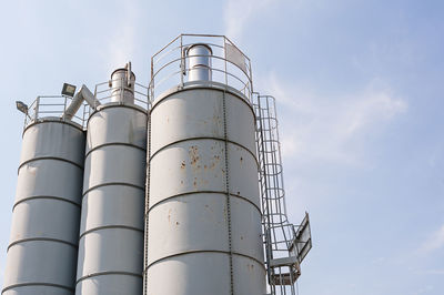 Low angle view of smoke stack against sky