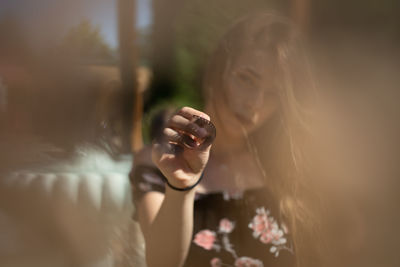 Portrait of woman holding film roll