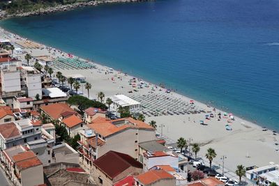 High angle view of townscape by sea