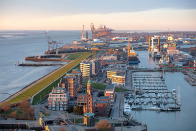 High angle view of commercial dock against sky during sunset