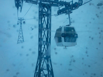 High angle view of overhead cable car covered with snow